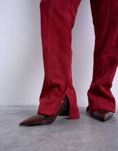 Model wearing Co ord real suede flare trousers in red