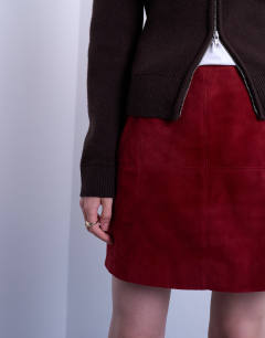 Model wearing Co-ord real suede mini skirt in burgundy