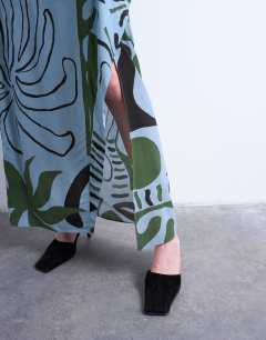 Model wearing Co ord sarong maxi skirt in blue abstract leaf print