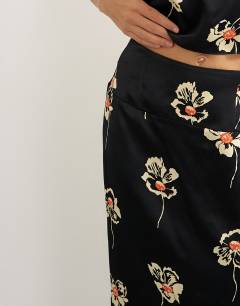 Model wearing Co-ord satin midi skirt in floral print