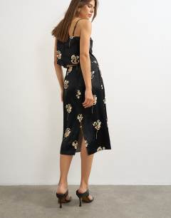 Model wearing Co-ord satin midi skirt in floral print