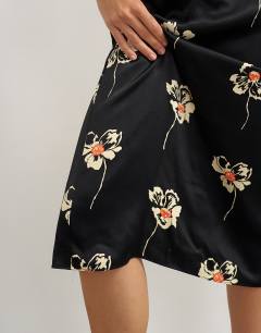 Model wearing Co-ord satin midi skirt in floral print
