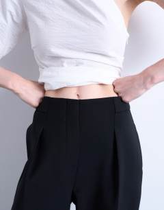 Model wearing Co ord slouchy clean waist band tailored trouser in black 