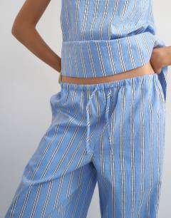 Model wearing Co ord straight leg trouser in blue stripe
