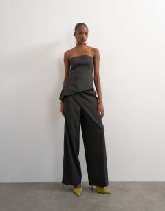 Model wearing Co ord stripe asymmetric seamed bandeau in brown