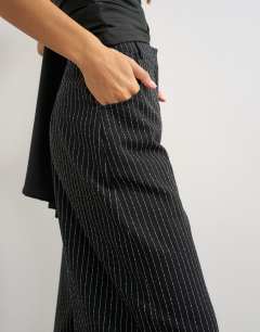 Model wearing Co ord stripe tailored pleat detail low rise trouser in black
