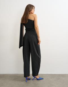 Model wearing Co ord stripe tailored pleat detail low rise trouser in black