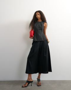 Model wearing Co ord striped assymetric hem top in black