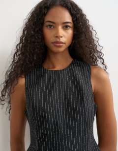 Model wearing Co ord striped assymetric hem top in black