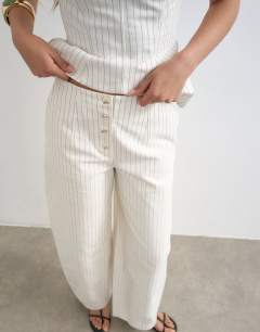 Model wearing Co ord striped barrel trouser in white