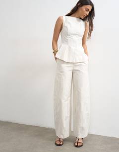 Model wearing Co ord striped barrel trouser in white