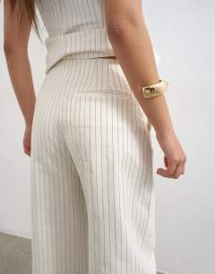 Model wearing Co ord striped barrel trouser in white