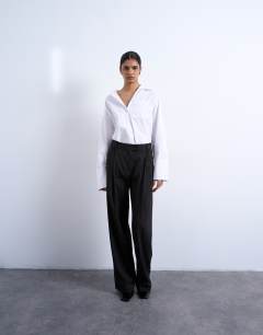 Model wearing Co ord subtle pinstripe low rise buckle detail trouser in dark chocolate