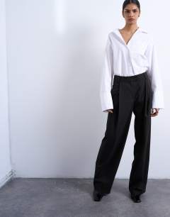 Model wearing Co ord subtle pinstripe low rise buckle detail trouser in dark chocolate