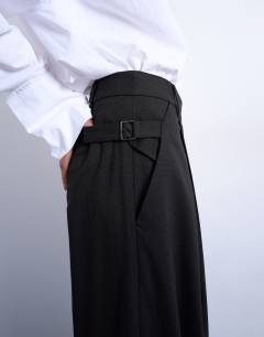 Model wearing Co ord subtle pinstripe low rise buckle detail trouser in dark chocolate