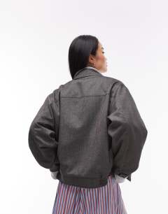 Model wearing Co ord tailored bomber style jacket in charcoal