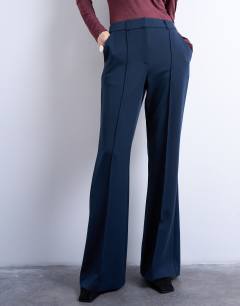 Model wearing Co ord tailored flare trouser in navy