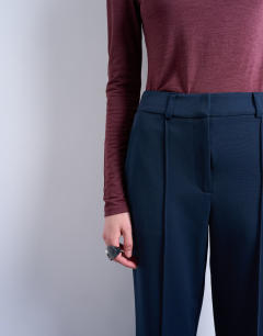 Model wearing Co ord tailored flare trouser in navy
