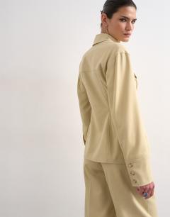 Model wearing Co ord tailored shirt with pleats in sage
