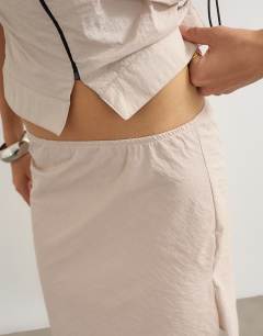 Model wearing Co-ord techy 90s length skirt in ecru