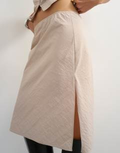 Model wearing Co-ord techy 90s length skirt in ecru