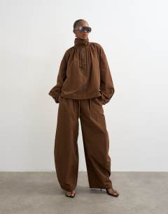 Model wearing Co ord techy lightweight ovoid trouser in chocolate