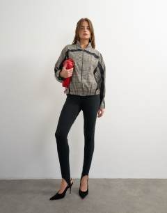 Model wearing Co-ord techy long sleeved zip through top in green check