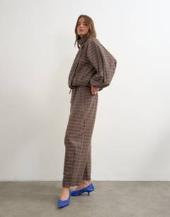 Model wearing Co-ord techy trouser in brown check