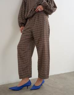 Model wearing Co-ord trouser in brown check