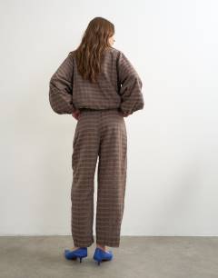 Model wearing Co-ord trouser in brown check
