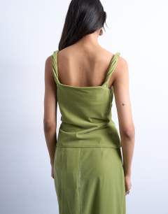 Model wearing Co-ord twist shoulder velvet cami in avocado