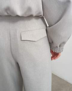 Model wearing Co ord twisted seam slim trouser in grey 