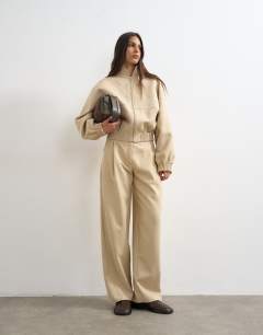 Model wearing Co ord twisted seam slim trouser in sand