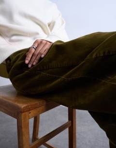 Model wearing Co ord velvet barrel leg seam detail trouser in khaki