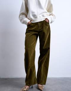 Model wearing Co ord velvet barrel leg seam detail trouser in khaki