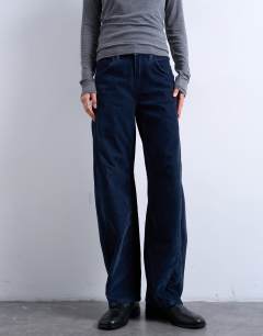 Model wearing Co ord velvet barrel leg seam detail trouser in navy