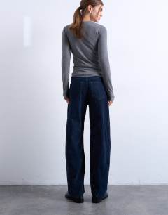 Model wearing Co ord velvet barrel leg seam detail trouser in navy