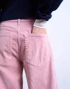 Model wearing Co ord velvet barrel leg seam detail trouser in pink