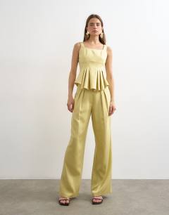 Model wearing Co ord wedding guest occasion pleated slouchy leg trouser in buttermilk