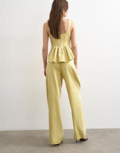 Model wearing Co ord wedding guest occasion pleated slouchy leg trouser in buttermilk