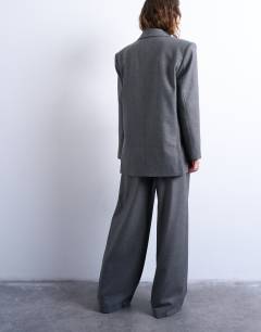 Model wearing Co ord wide pleat trousers in grey