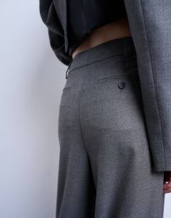 Model wearing Co ord wide pleat trousers in grey