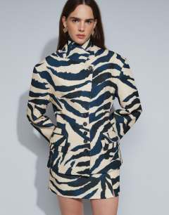 Model wearing Co-ord zebra print high neck blazer in zebra