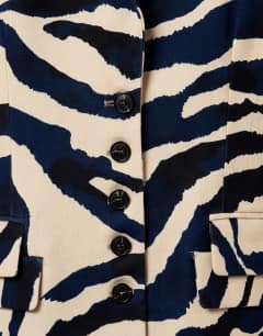 Model wearing Co-ord zebra print high neck blazer in zebra