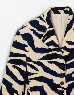Model wearing Co-ord zebra print high neck blazer in zebra