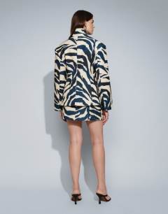 Model wearing Co-ord zebra tailored mini skirt in zebra