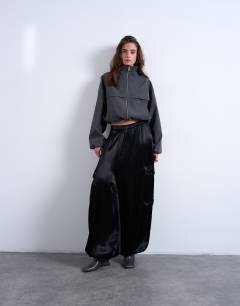 Model wearing Co rd funnel neck jacket in charcoal stripe