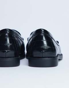 Model wearing Coby ruched toe croc loafer in black