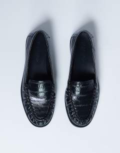 Model wearing Coby ruched toe croc loafer in black