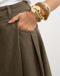 Model wearing Cocoon maxi skirt in khaki
